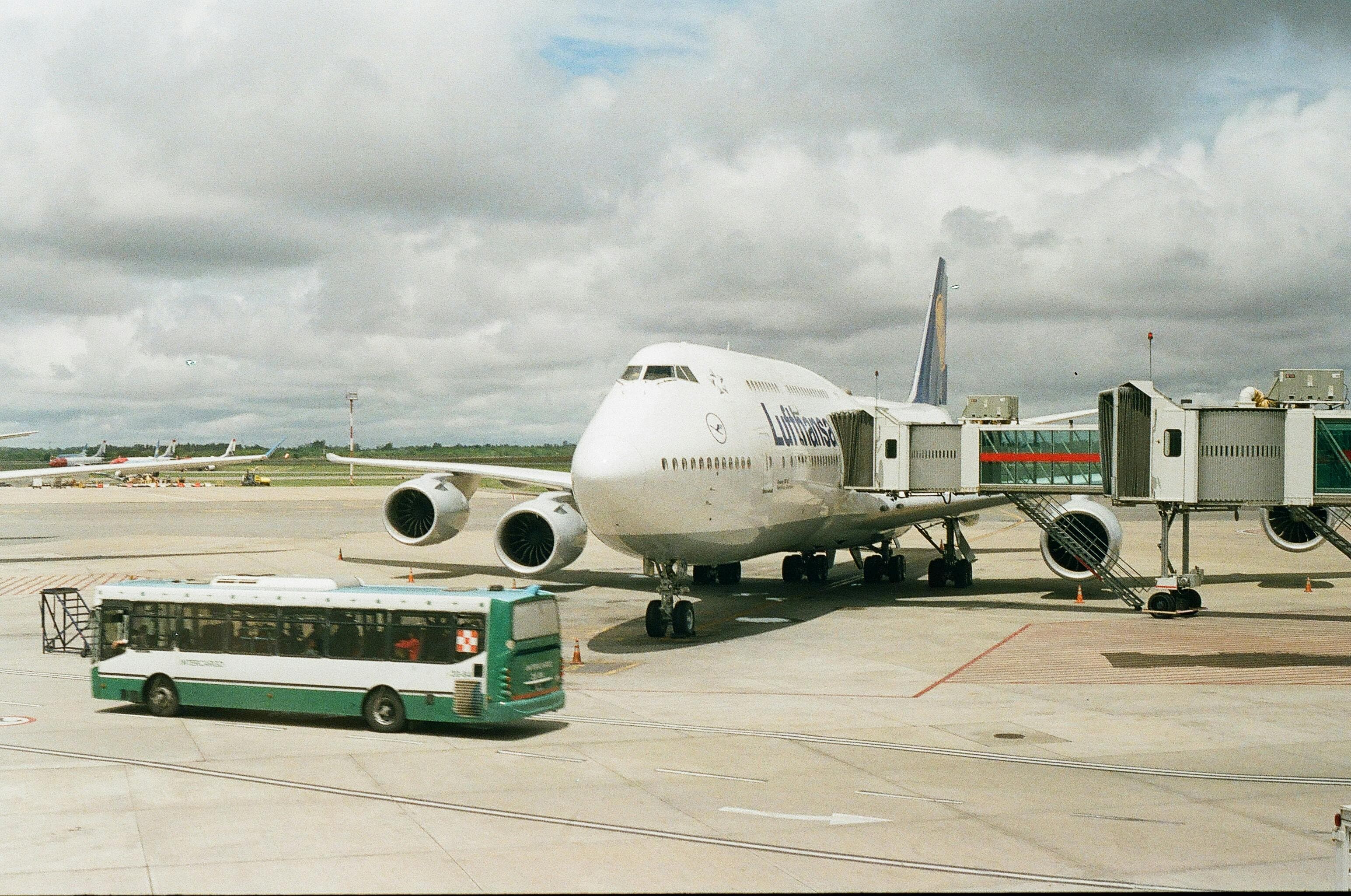 Group with luggage boarding an airport shuttle